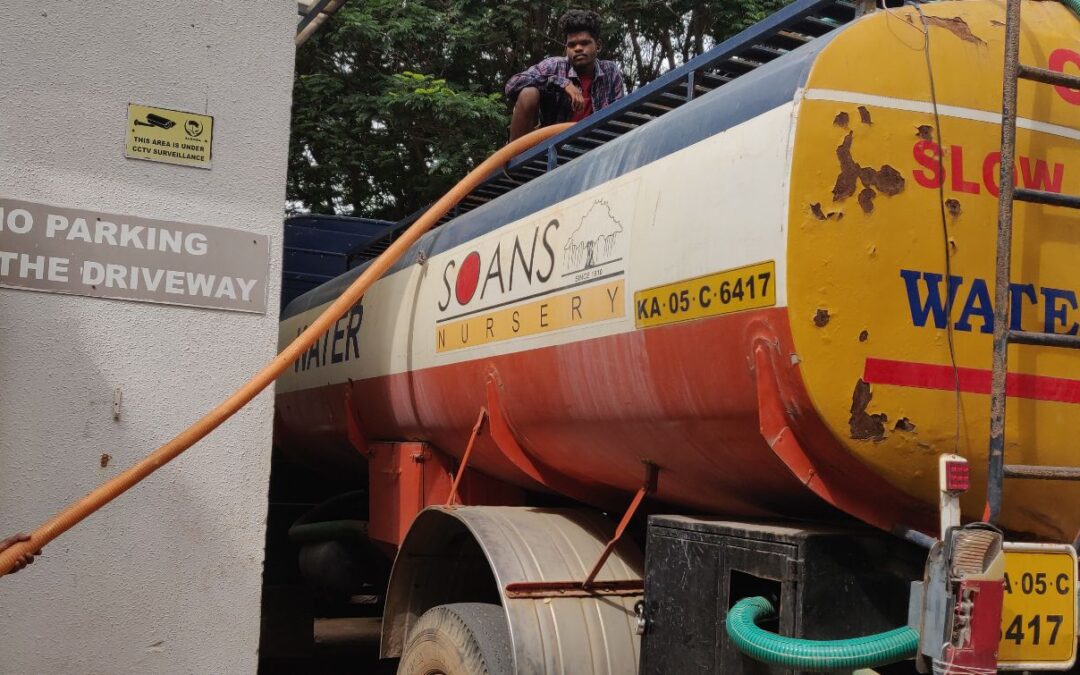 A water tanker being filled in Bengaluru, Karnataka, India.