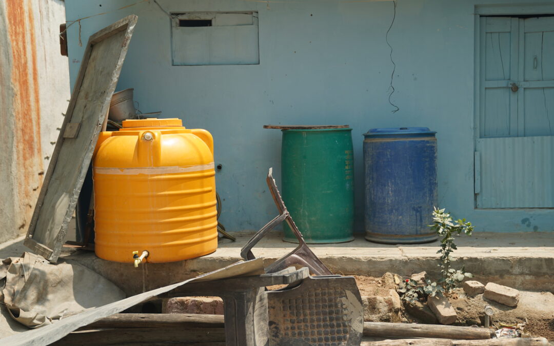 Water drums outside a home in India