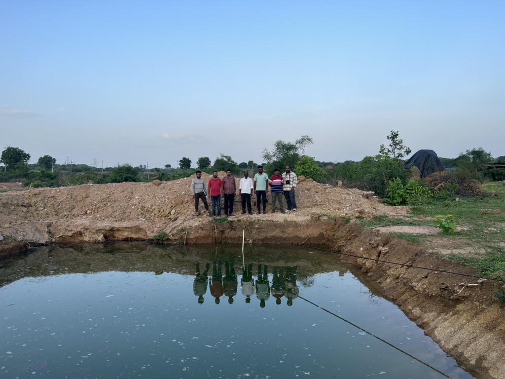 The team installed a staff gauge in a farm pond in Toopran, Telangana to measure water levels over time. Photo credit: Vanya Mehta