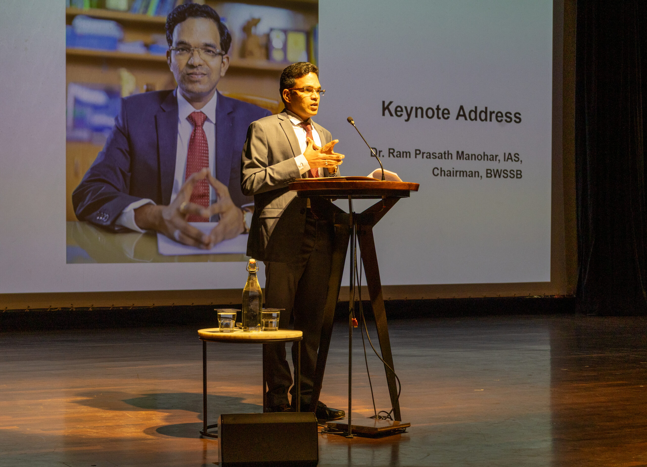 6 people standing next to each other in an office space
