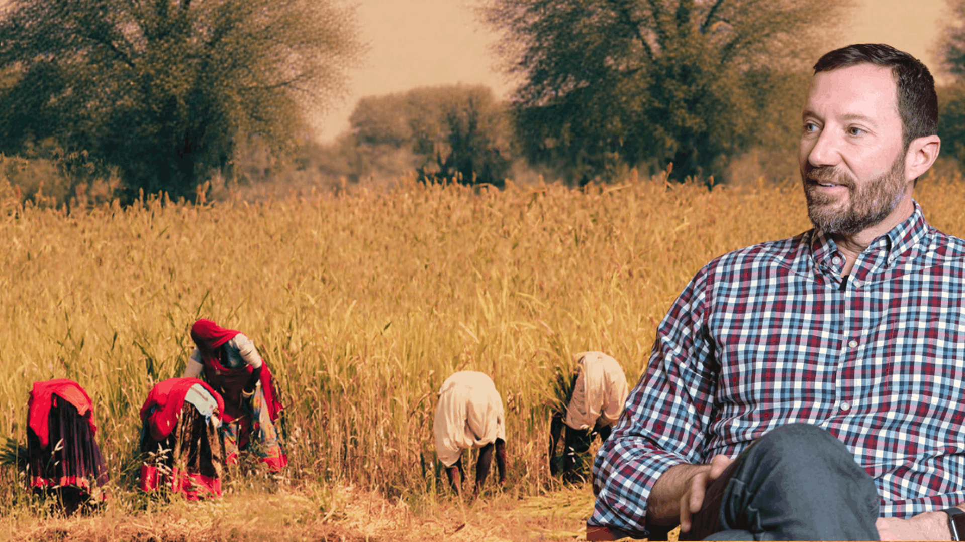 Image of Alan MacDonald in the foreground, and an image of the Ganges river basin in the background. Clear water flows in the river from hills, towards the viewer.